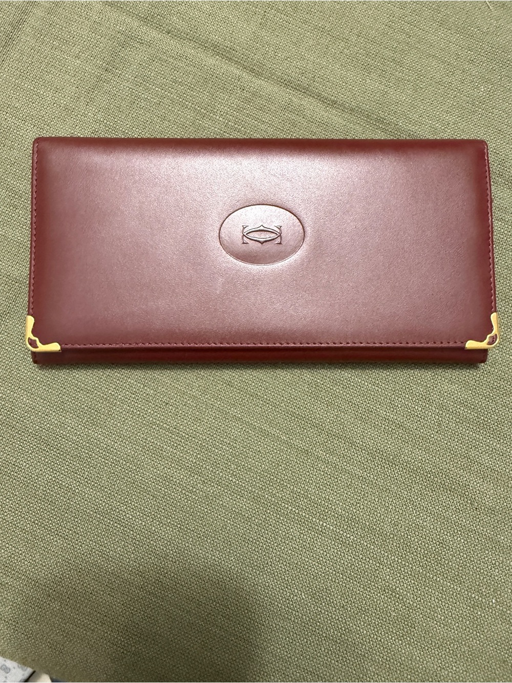 Cartier Burgundy Leather Card with Gold Corner Accents